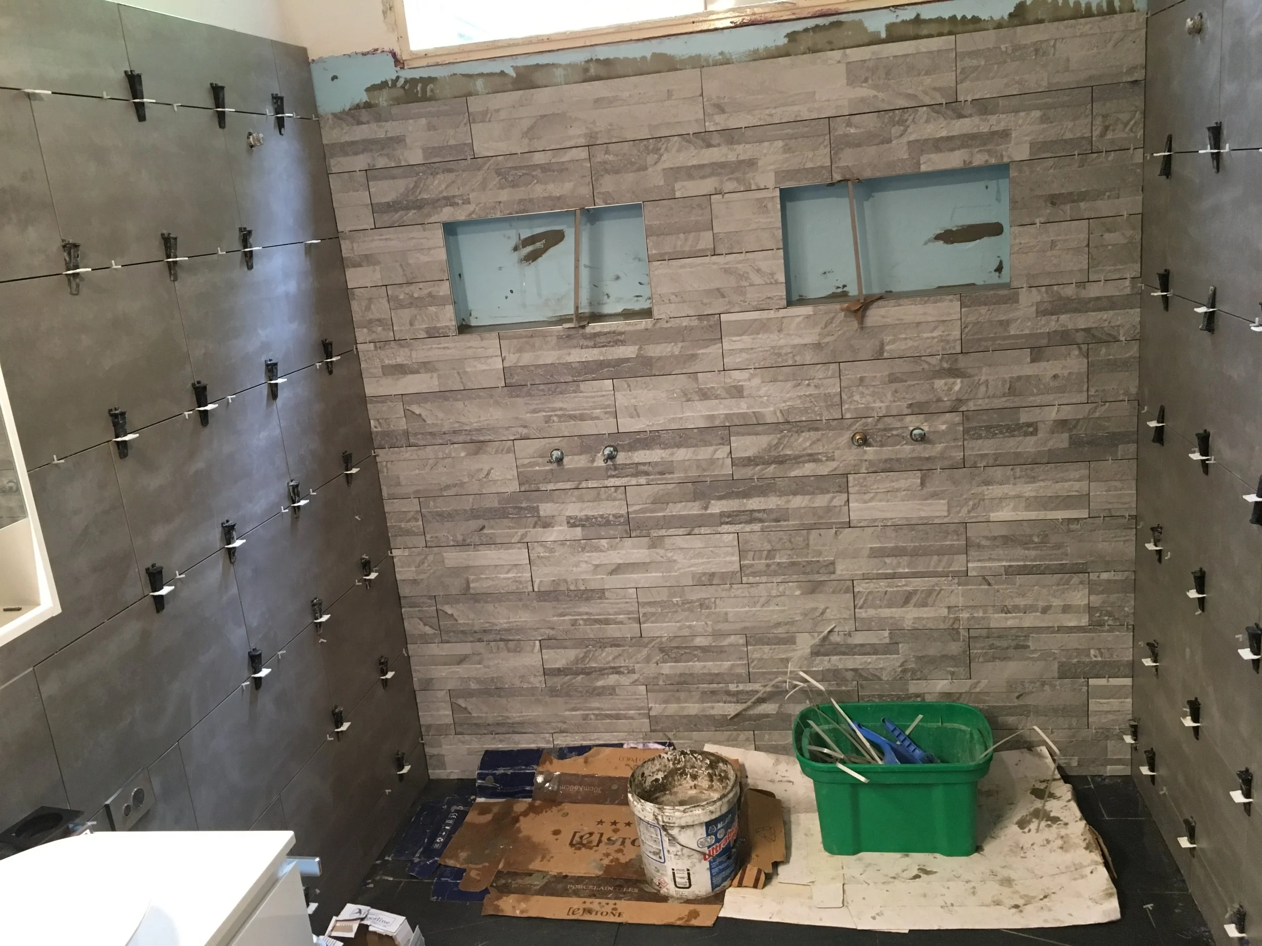 8. INSTALLATION OF TILES CLOSE TO COMPLETION.JPG