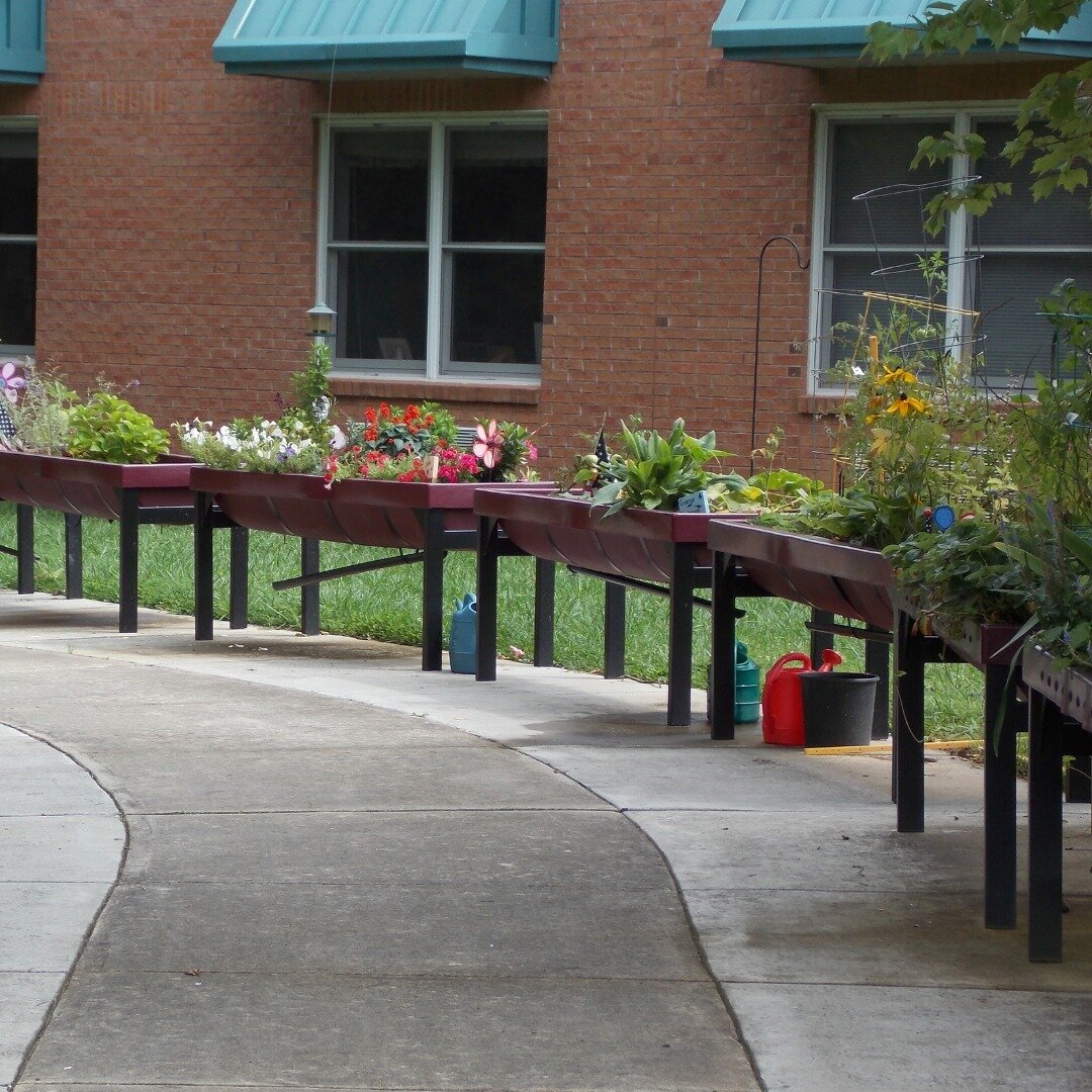 At Union County Nursing Home in Georgia, elevated mini gardens line a sidewalk where residents are able to care for a garden of their own and harvest the vegetables or fruits they grow. All gardens are wheelchair accessible, providing every resident 