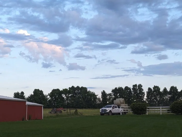 Truck+pulling+hay+with+sky+background.jpg