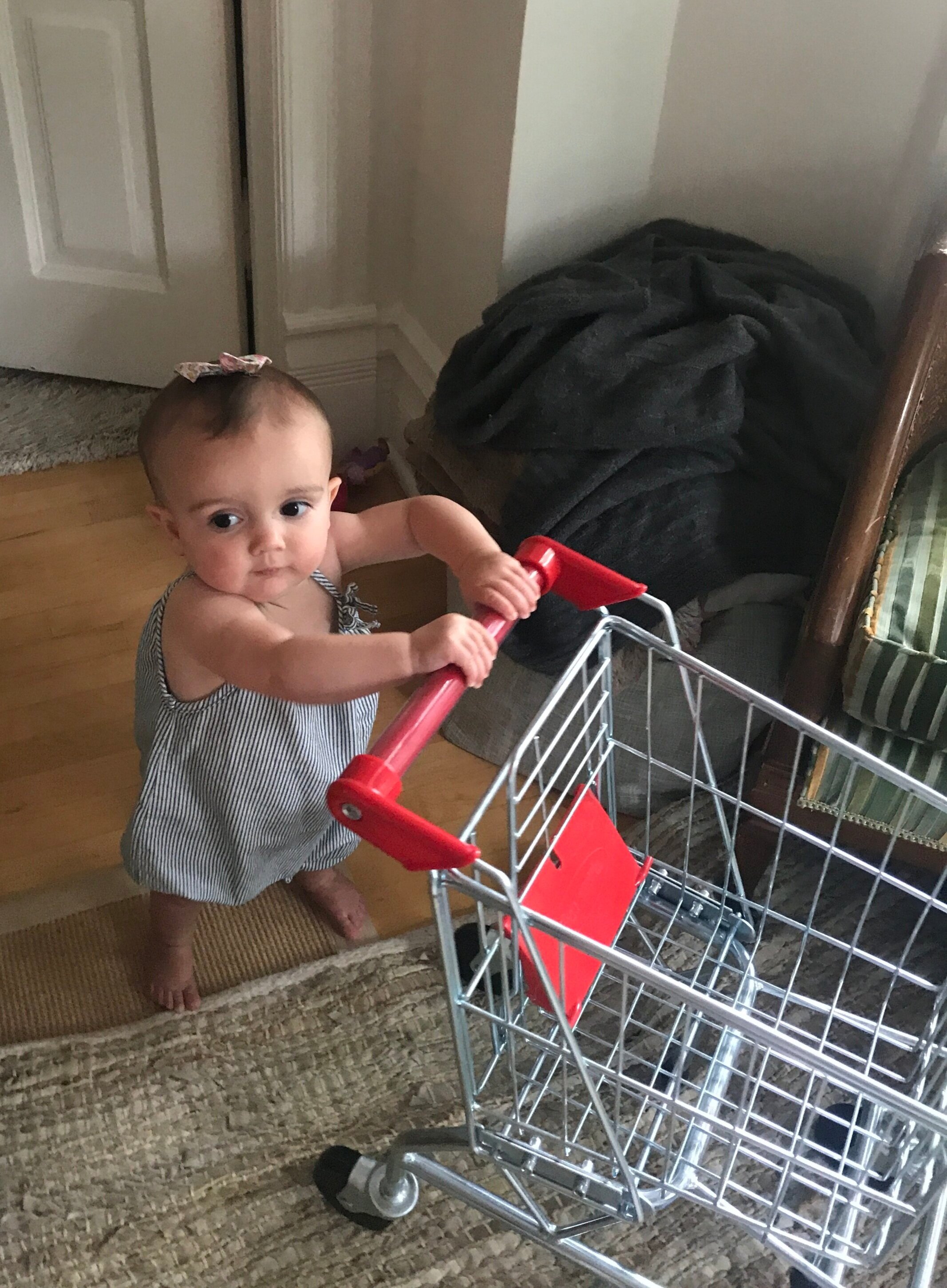 My daughter 3 years ago with her shopping cart.