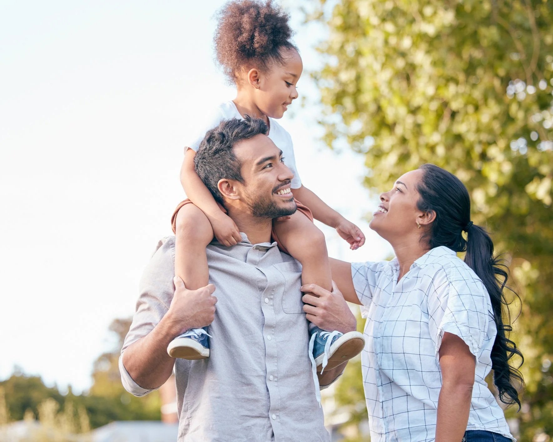 Happy family smiling together after family counselling session at Couples Corner Counselling Moncton NB