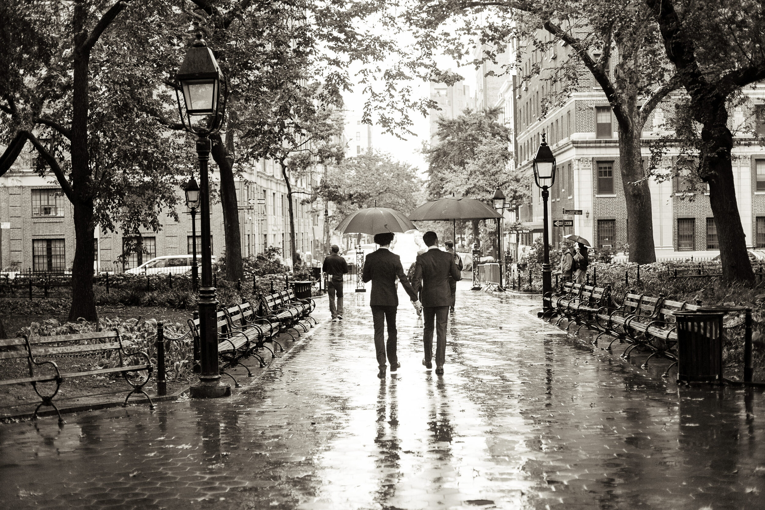 16_MWport_brian_drew_0120_Gay_Wedding_Umbrellas_Rain_Madison_Square_Park_NYC_Black_And_White.jpg