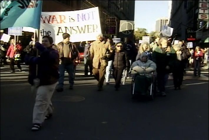 Zinn Marching Iraq War.jpg