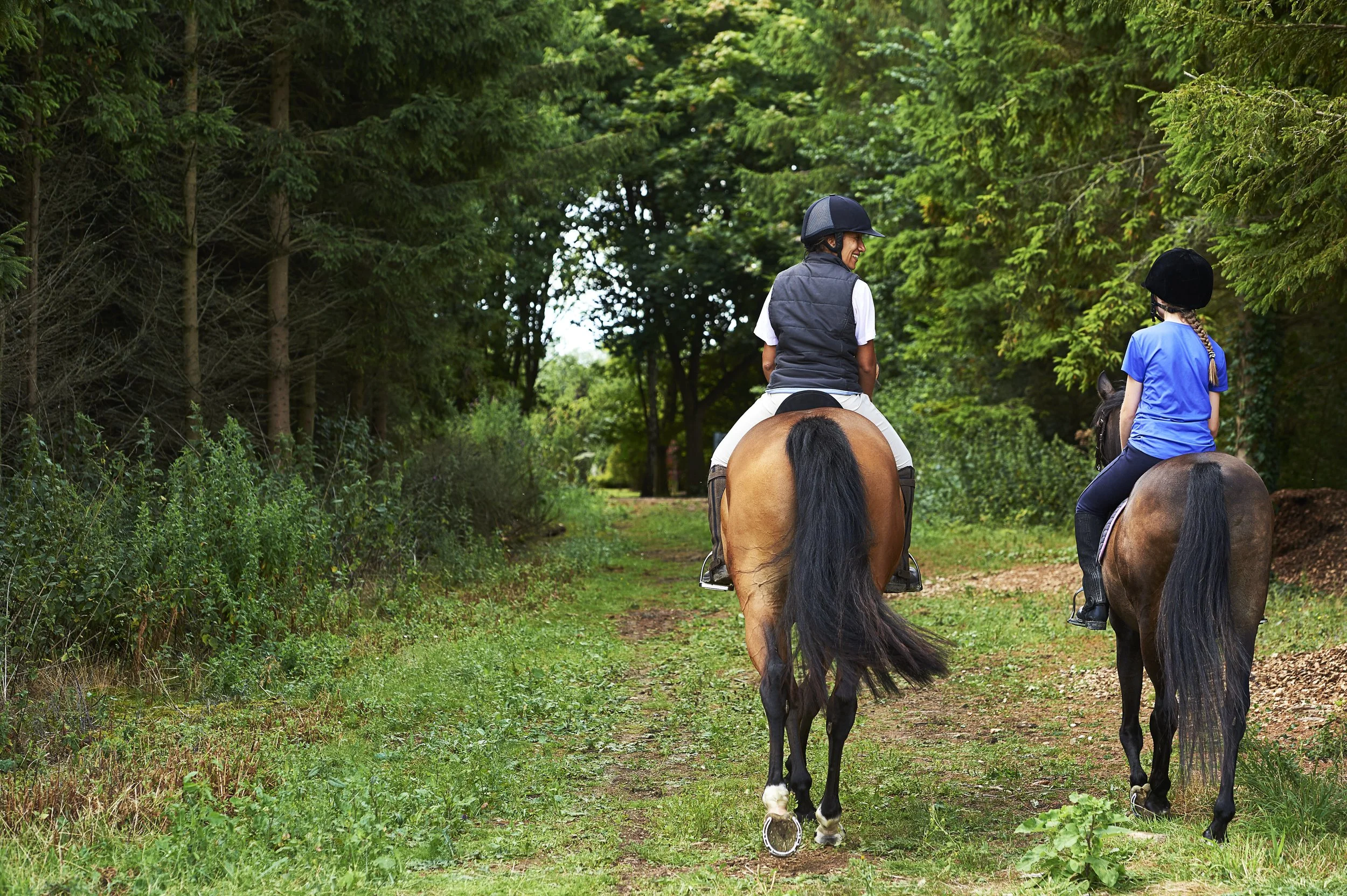 rear-view-of-mature-woman-and-girl-horse-riding-2026-01-09-09-13-38-utc.jpg