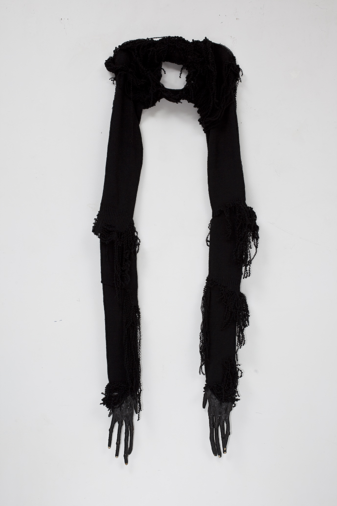 Ancestor , 2010, wood, paint, glue, felt, plastic bags, artist’s jersey, hooks.