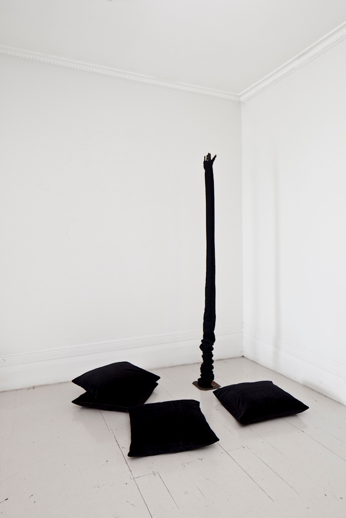 Giving it up , 2011, wood, wire, cork, felt, cotton, metal stand, velvet cushions.