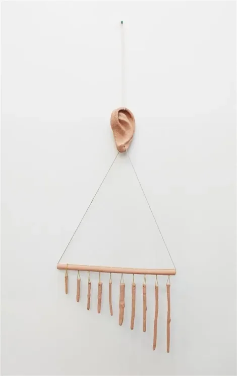   Adornment (for ear)  .2024. Fired clay, cotton cord. 1380 x 510 x 50mm 
