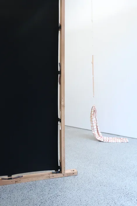  Installation view of  Dad . 2024. Hand-painted calico, cord, thread, fired clay. 3000 x 240 x 240mm 