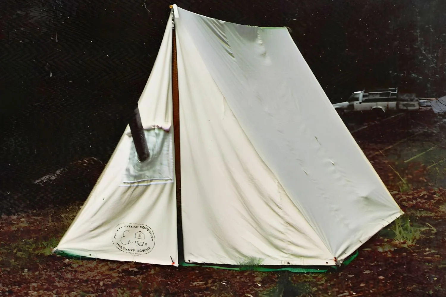 Wedge tent with stove pipe.jpg