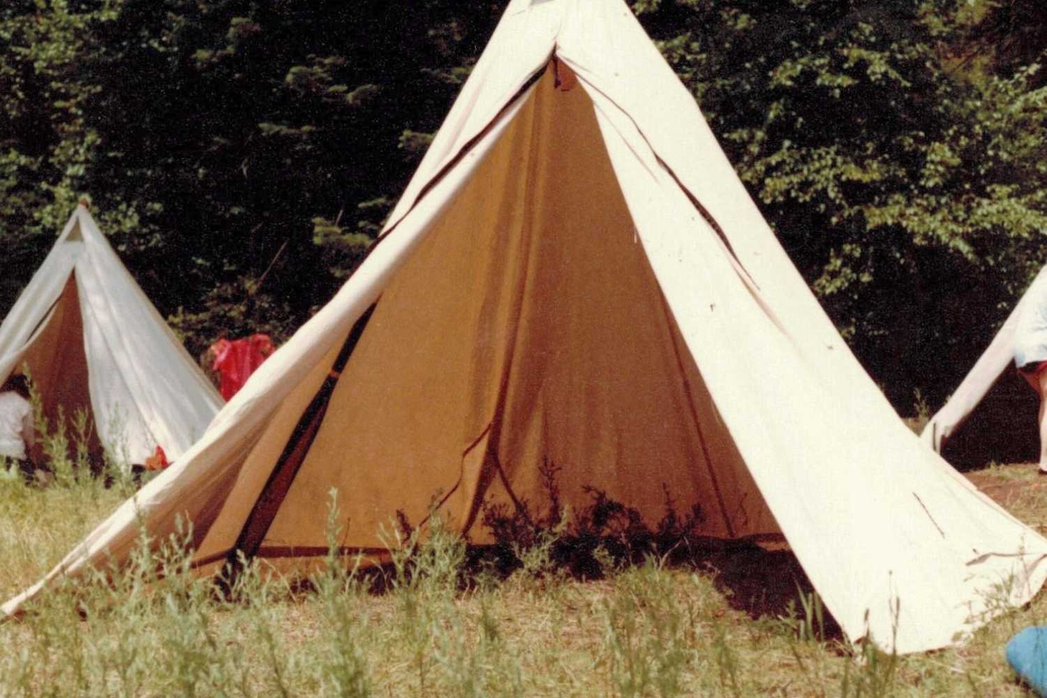 range tent with door open on grass