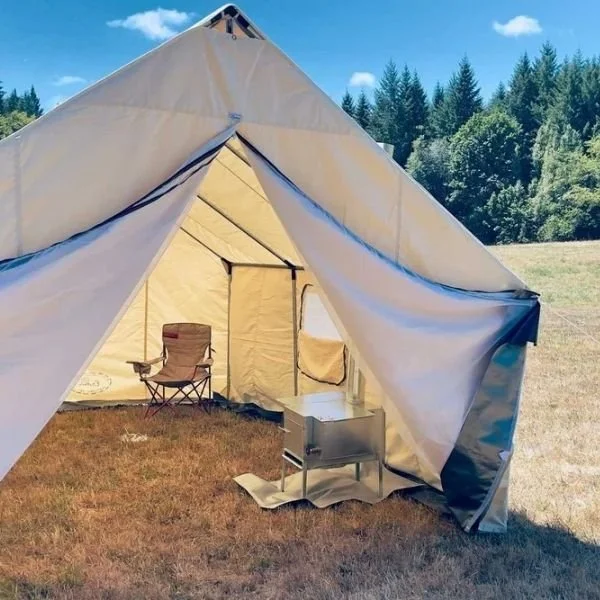 white canvas wall tent with black zippers and interior angle