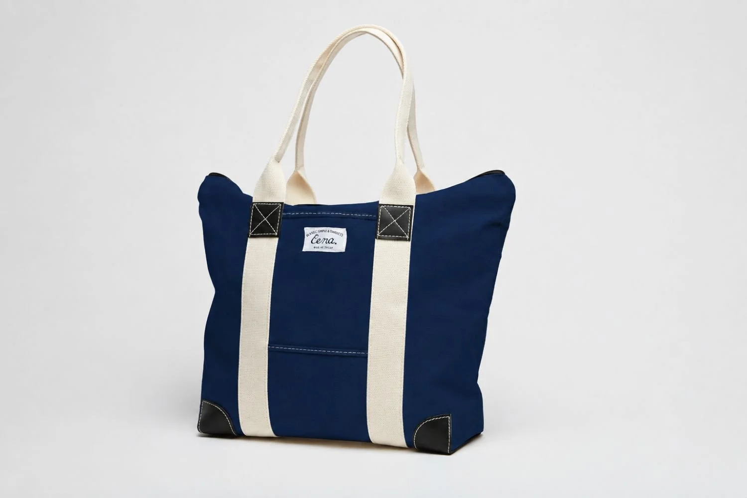 Navy canvas zip tote on whit background