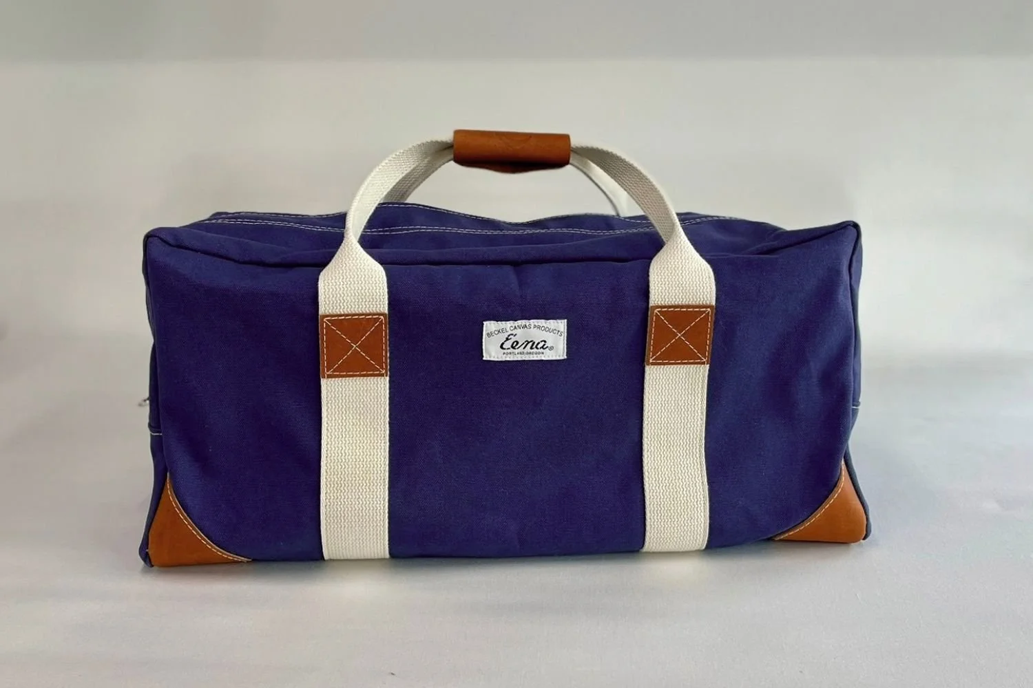 brown leathered duffel bag