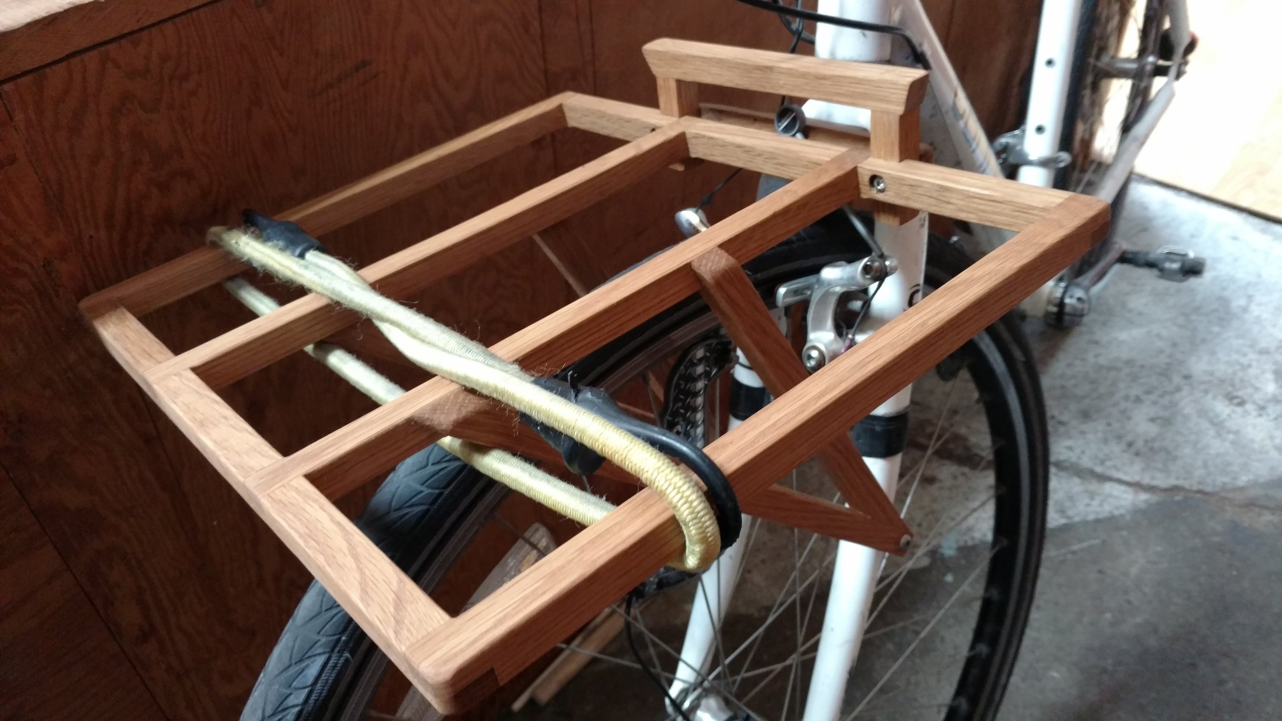 Custom bicycle cargo rack out of white oak. Very successful project.