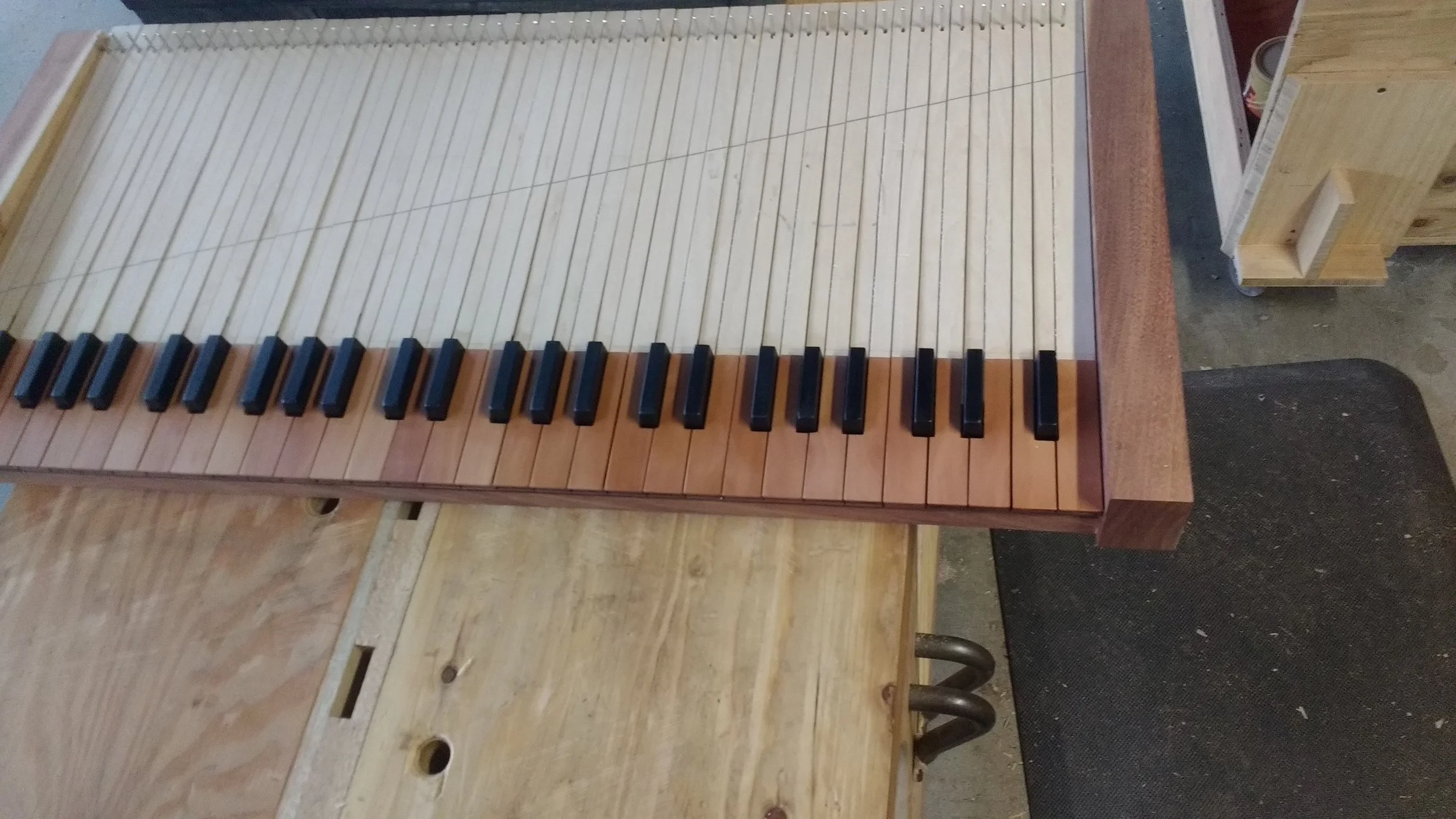 I built this keyboard from scratch. 5 different hardwood species, including real ebony sharps.