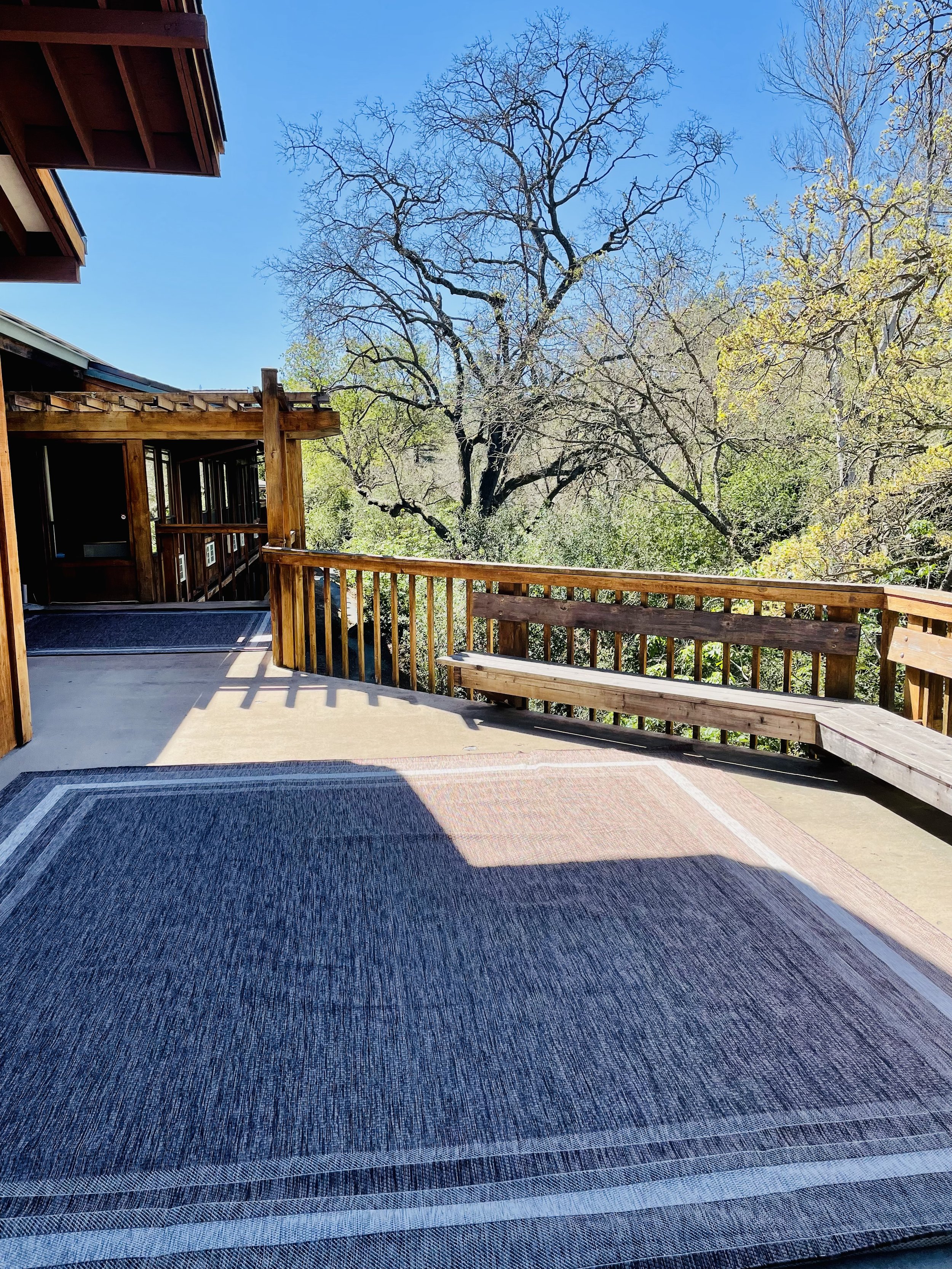Large deck to extend your space and enjoy the beautiful creek and oaks