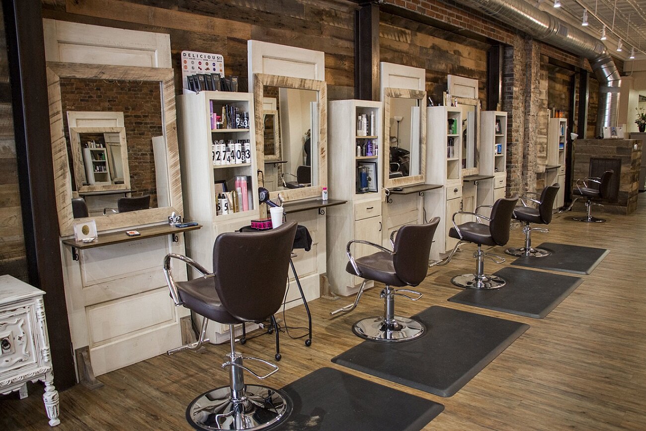 reclaimed wood paneling in use at a salon/barbershop