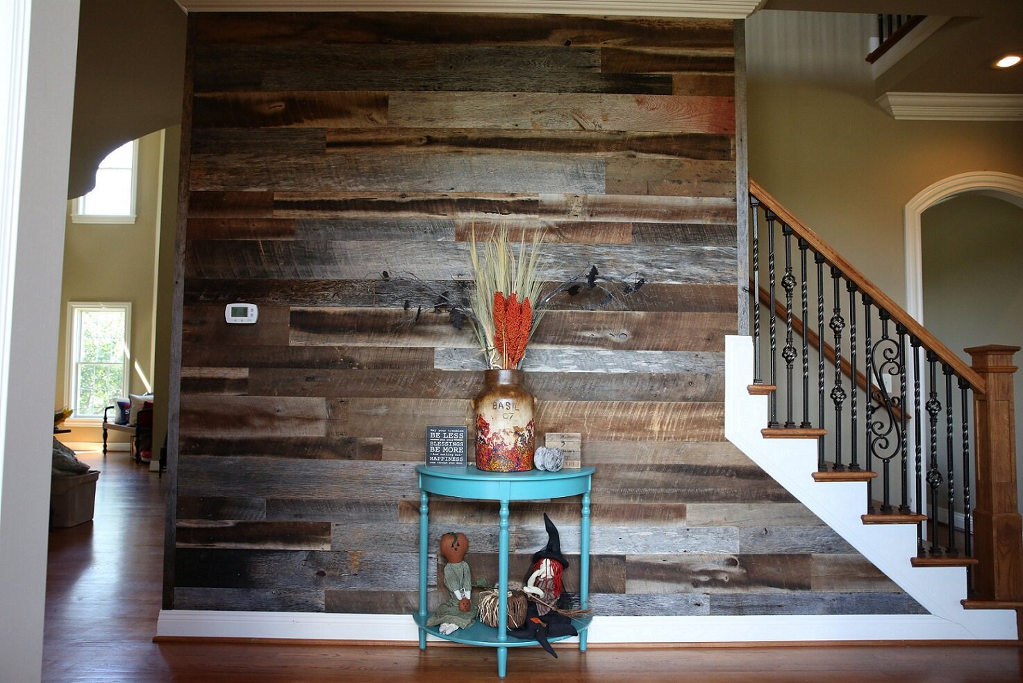 reclaimed wood paneling in use as an accent wall in a home