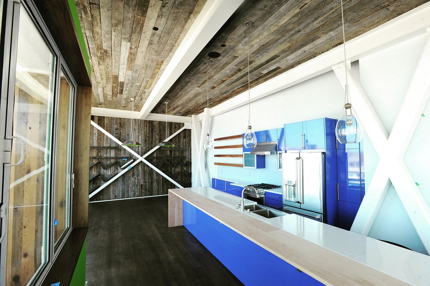 reclaimed hardwood paneling in use as an accent wall and on ceiling