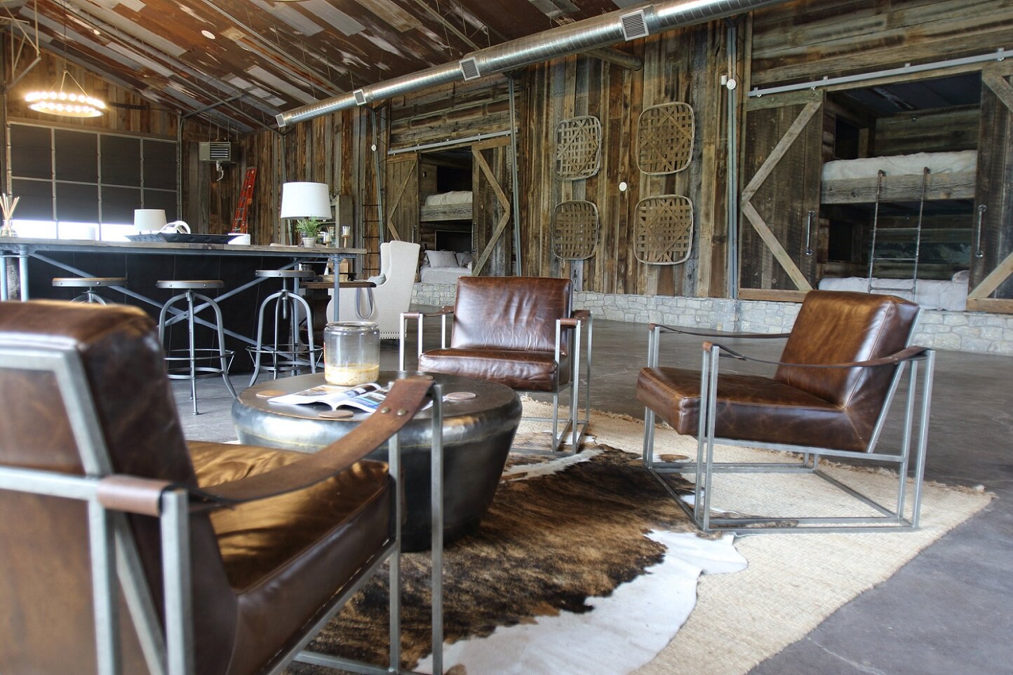 reclaimed wood paneling in use on wall and ceiling in a lounge area