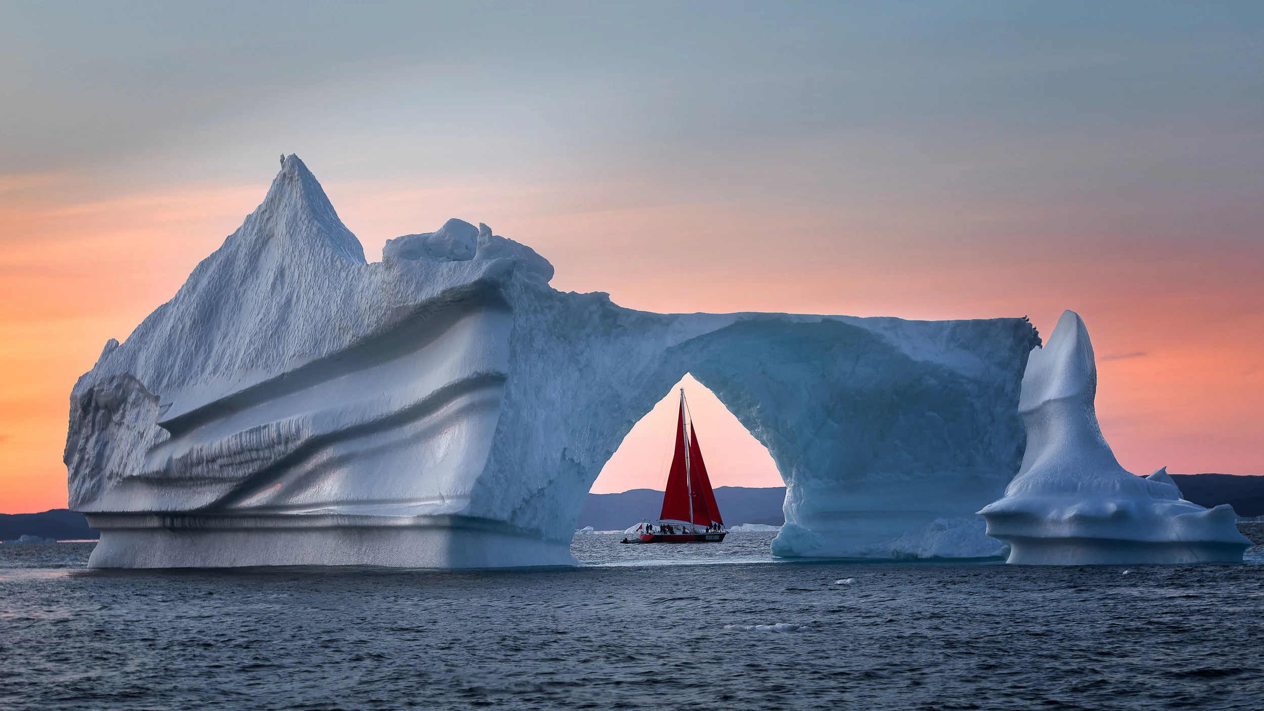 Midnight sun and red sail