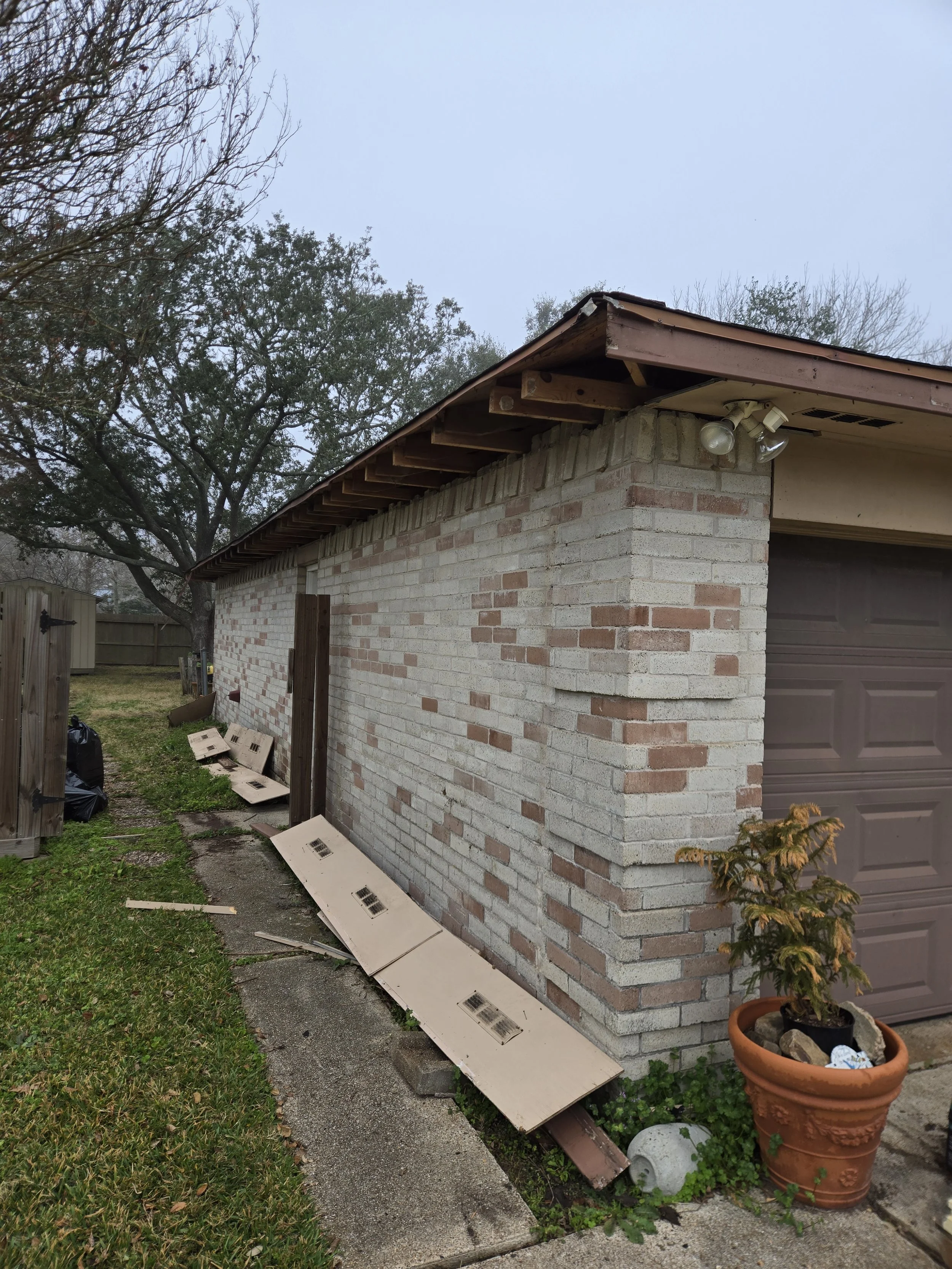 This is an image of the side of a house getting facia board, and soffit replacement in Houston