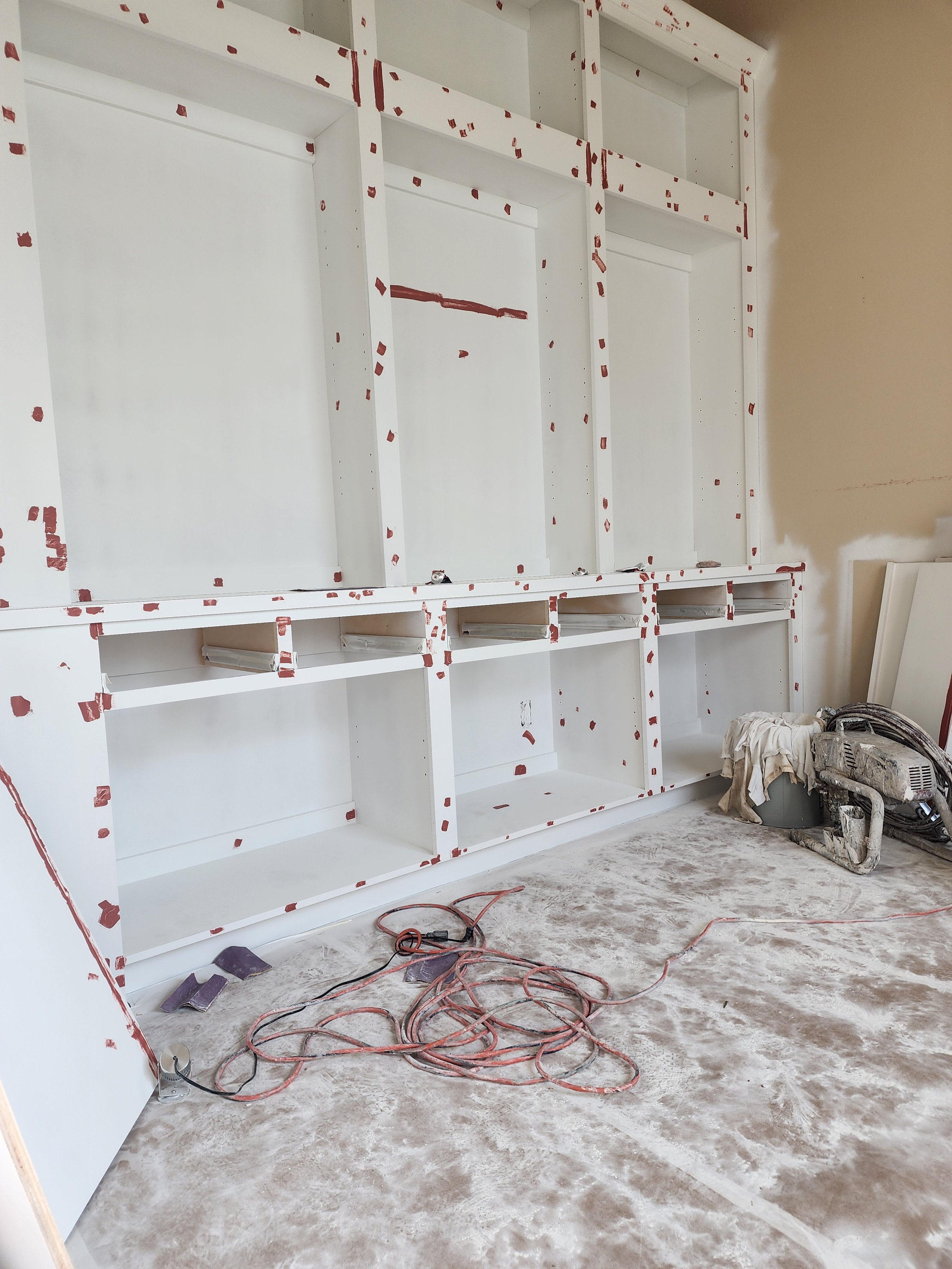 This is an image of a scuffed cabinet, with markers showing the scuffs