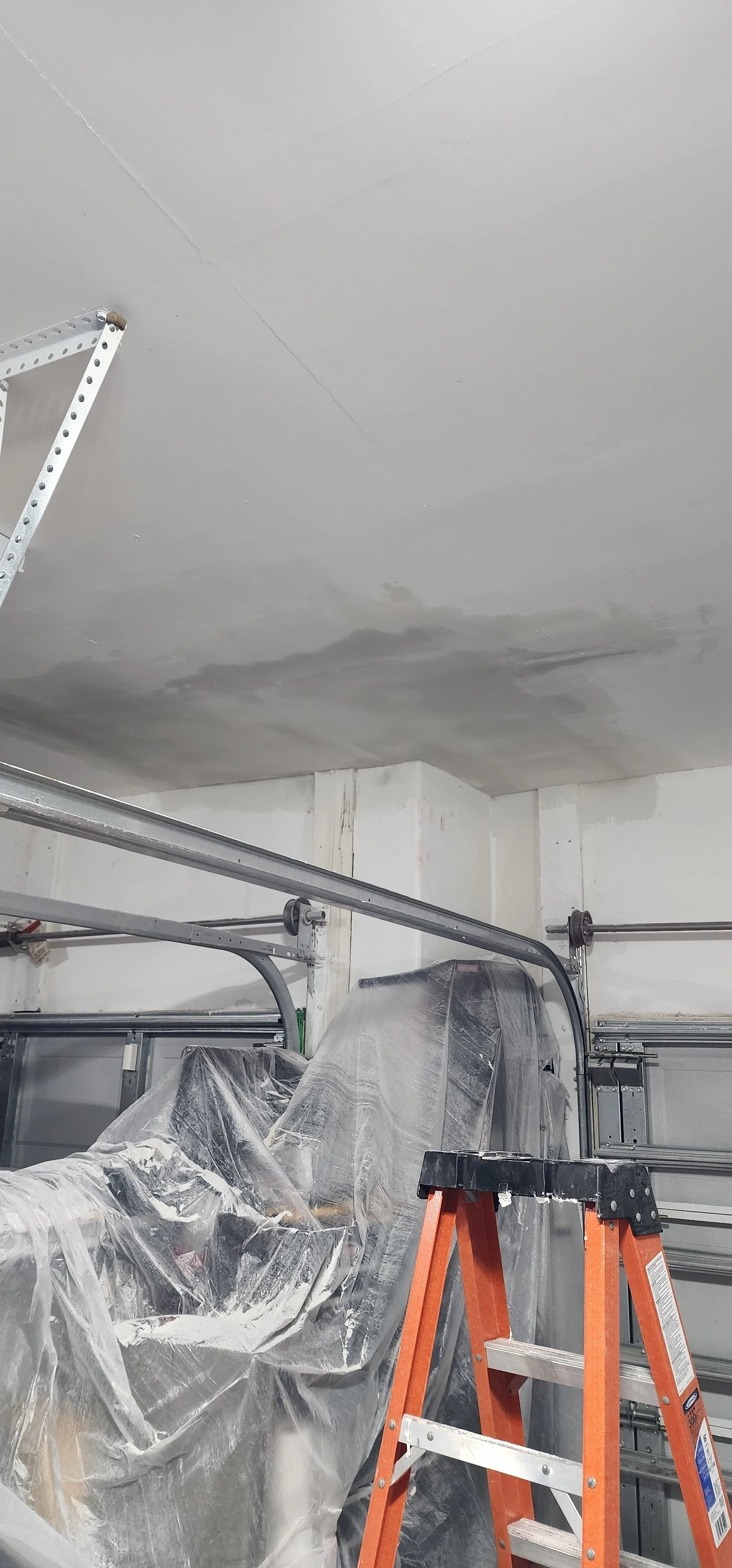 This is an image of a garage with uneven or faded paint