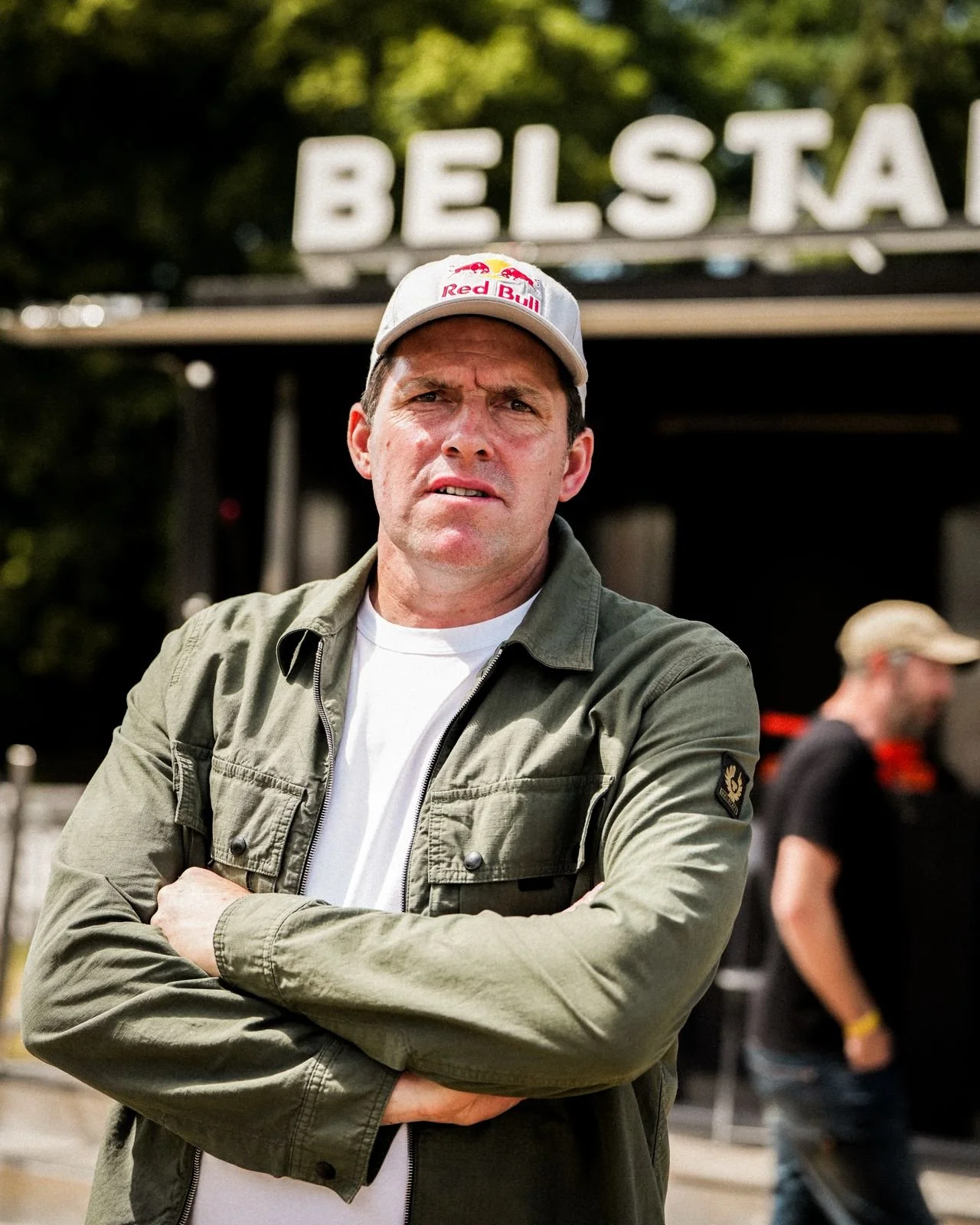Dougie Lampkin MBE stands in front of the Belstaff unit