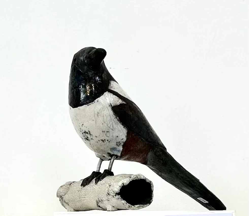 magpie on ceramic log.jpg