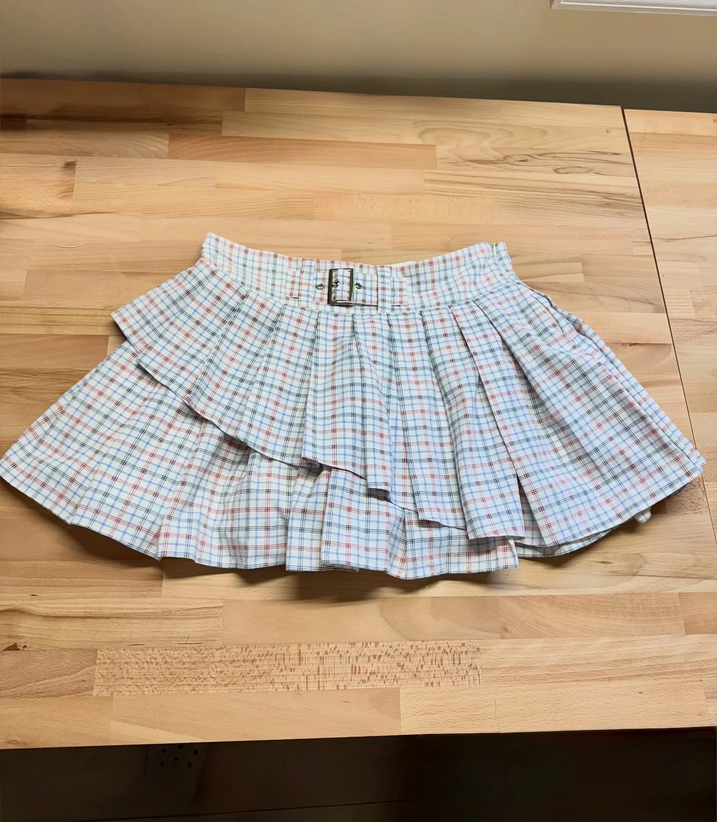 not your average skirt, she’s one of a kind ˚ʚ♡ɞ˚ our 1:1 asymmetrical pleated mini - size M - only a few left! #upcycledclothing #sustainablefashion
