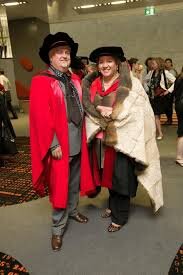  Prof. Ian Anderson and Prof.Megan Davis wearing the possum skin cloak at the 2012 Narrm oration, photograph credit Peter Casamento. 