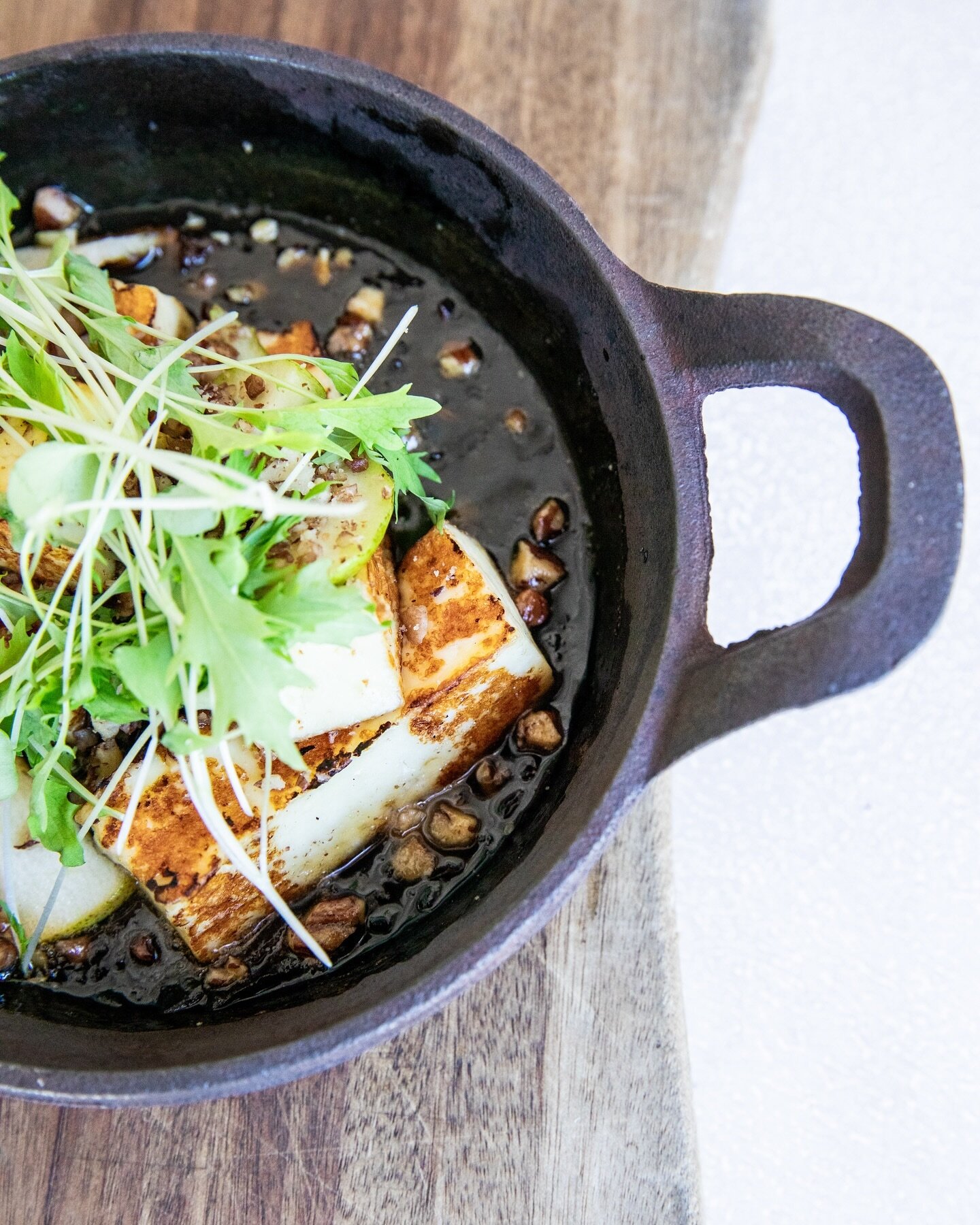 Our Haloumi has been a staple on the menu and a guest favorite for some time. It&rsquo;s served sizzling on a cast iron dish with onion jam, smoked honey, pecans and green mizuna. 

One guest said, &ldquo;the haloumi cheese dish was my favorite.  Wow