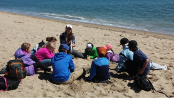 Gabby teaching a beach lesson during her time as an Educator at The Ecology School.