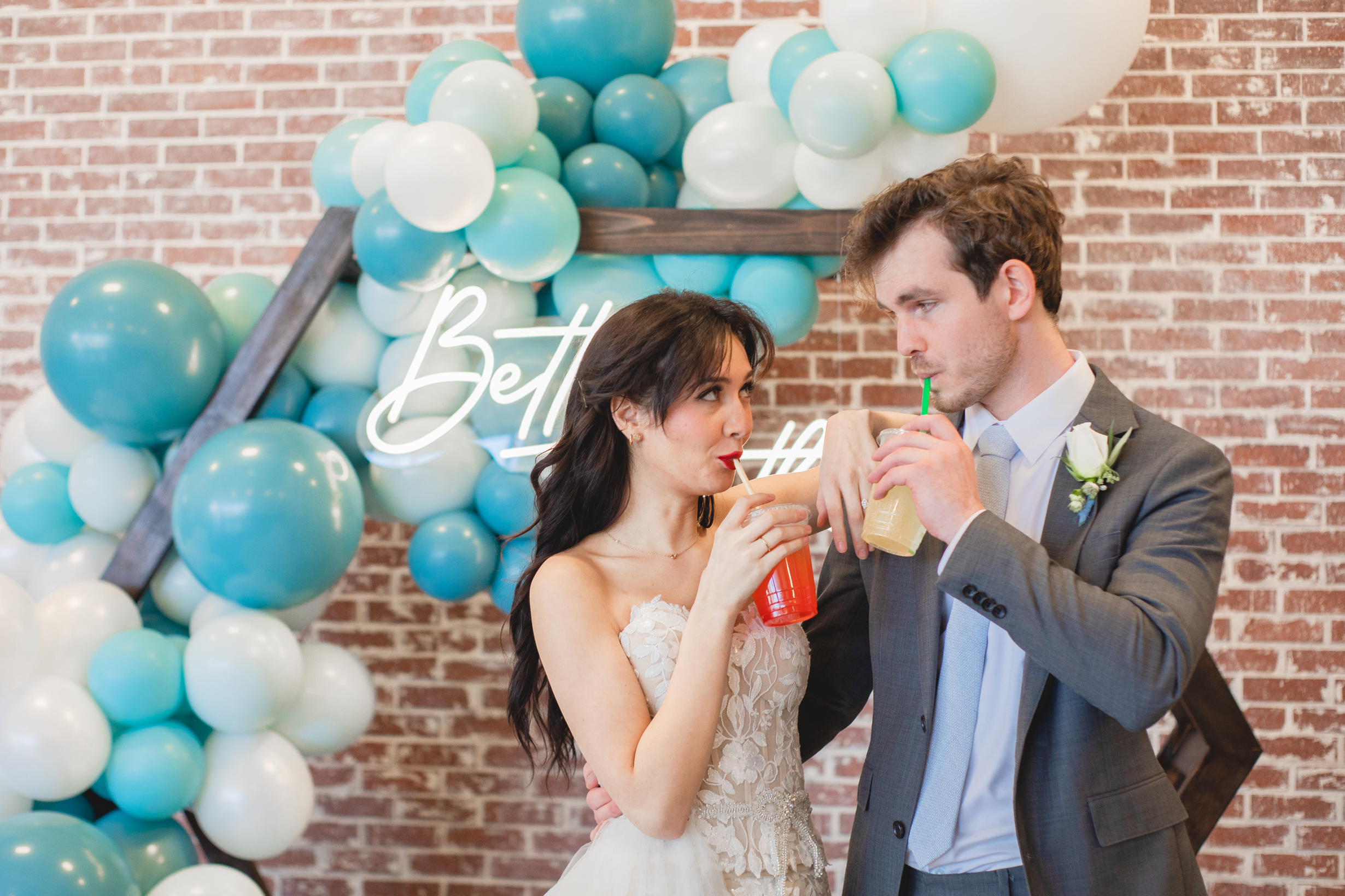 Bride & Groom Sharing Drinks