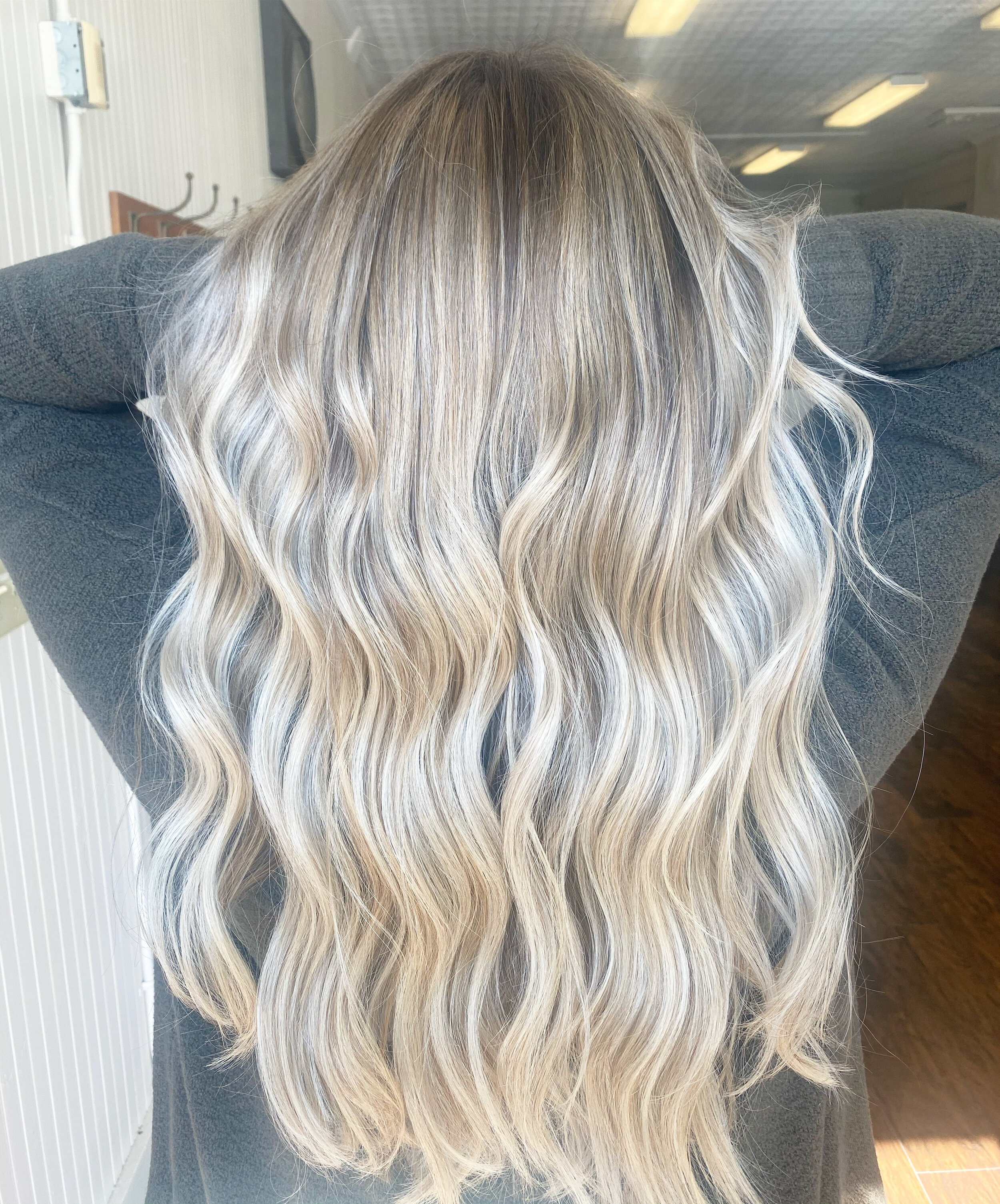 Rooted, icy blonde created by Carleigh Dlugosz