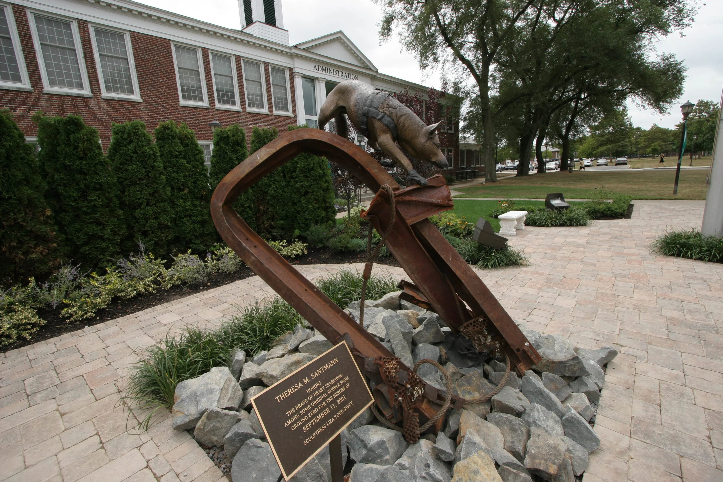 The second 911 Rescue Dog , made with the remaining scraps that Liza had obtained from Ground Zero, was donated by Theresa Santmann to the 911 Memorial Garden at Farmingdale State University on Long Island.