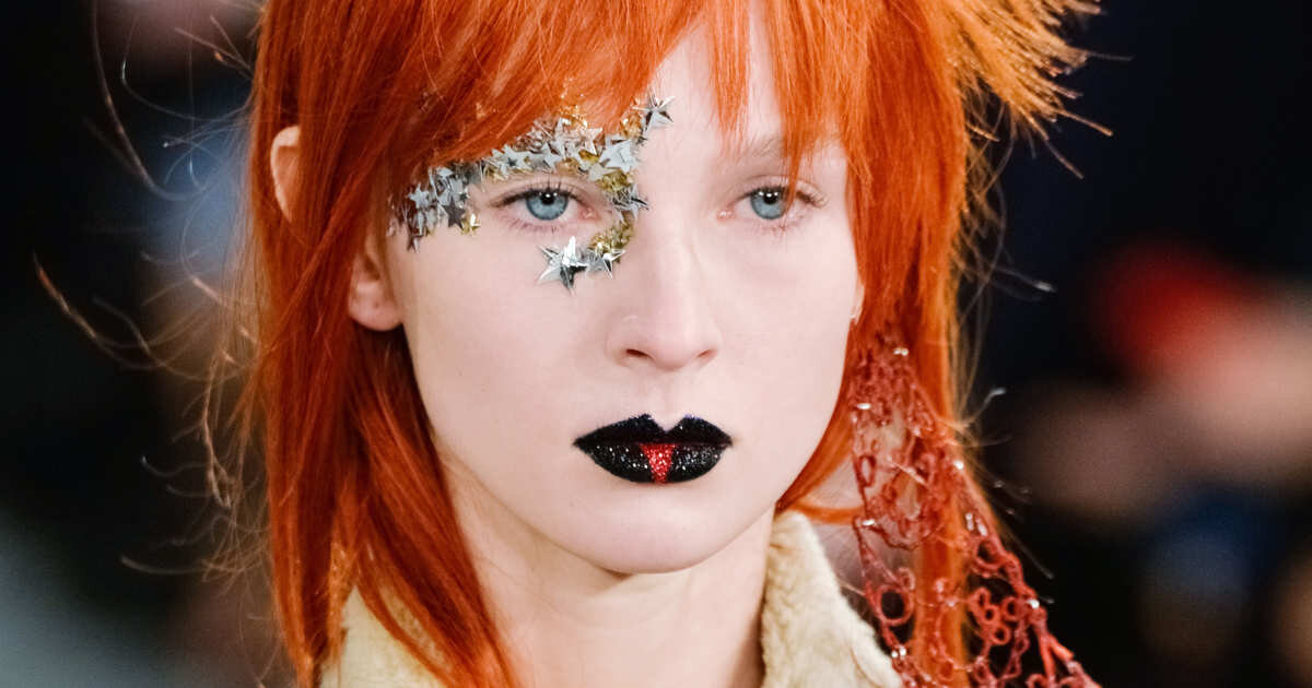 David Bowie inspired makeup at Maison Margiela 2018, by Pat McGrath: "It was celestial couture meets intergalactic glamour, with a touch of Bowie's 'Space Oddity' brought to life with 3D metallic stars and a structured, gothic mouth with a touch of …