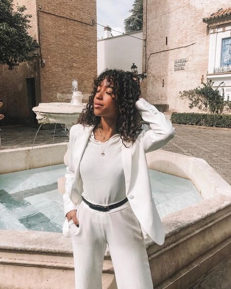 Amaka Hamelijnck is the ultimate poster girl for Dutch style in an all-white pantsuit. Photo: @amaka.hamelijnck on Instagram.