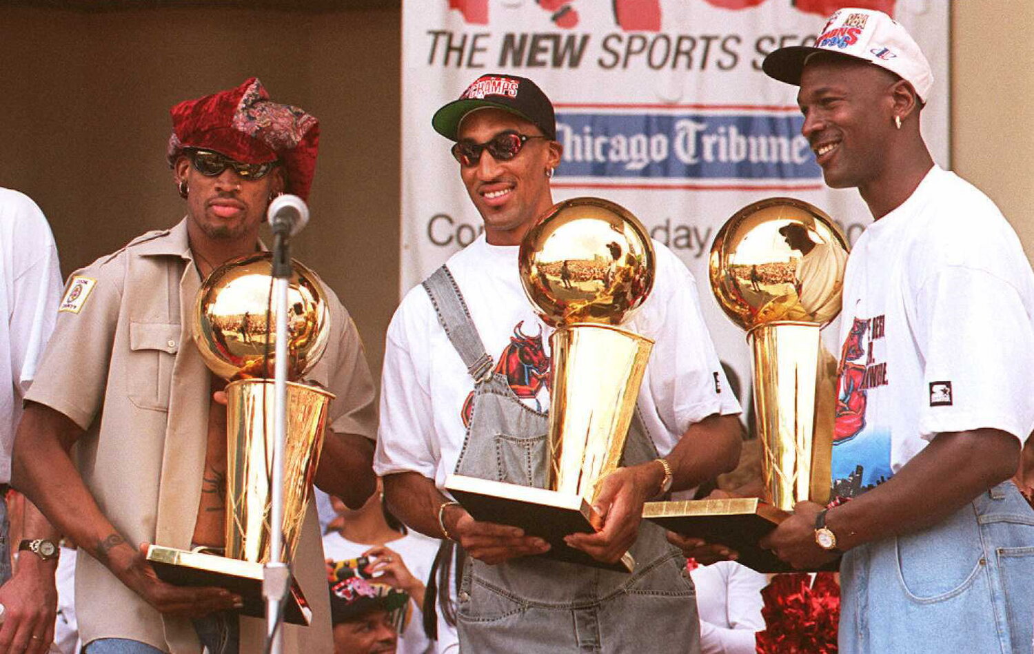 Dennis Rodman, Scottie Pippen, and Michael Jordan hold Larry O'Brien National Championship trophies at a rally in Chicago in June, 1996. Photo: Getty Images/Tim Zielenbach