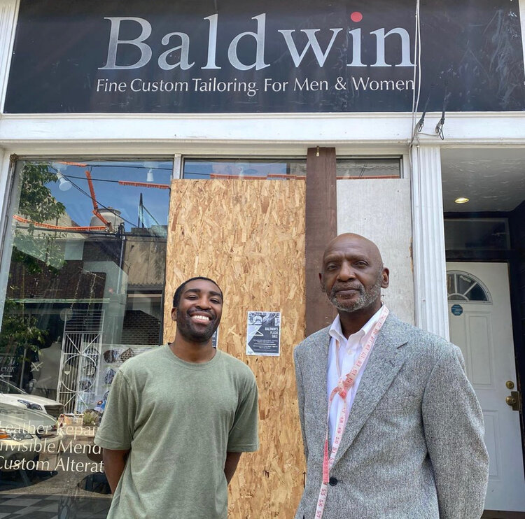 Christopher Baldwin (left) and Larnell Baldwin (right) outside Baldwin's Fine Custom Tailoring on Philadelphia’s historic Fabric Row. Photo: @mr.baldwins_shop