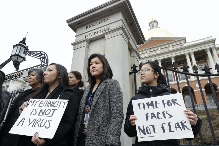 Members of Boston’s Asian American Commission gather to protest in front of Boston’s State House (March 12, 2020). Photo: NBC News
