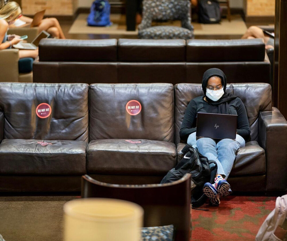 A student takes a study break in Texas A&M’s flag room, where social distancing measures have been implemented. Photo: @tamu