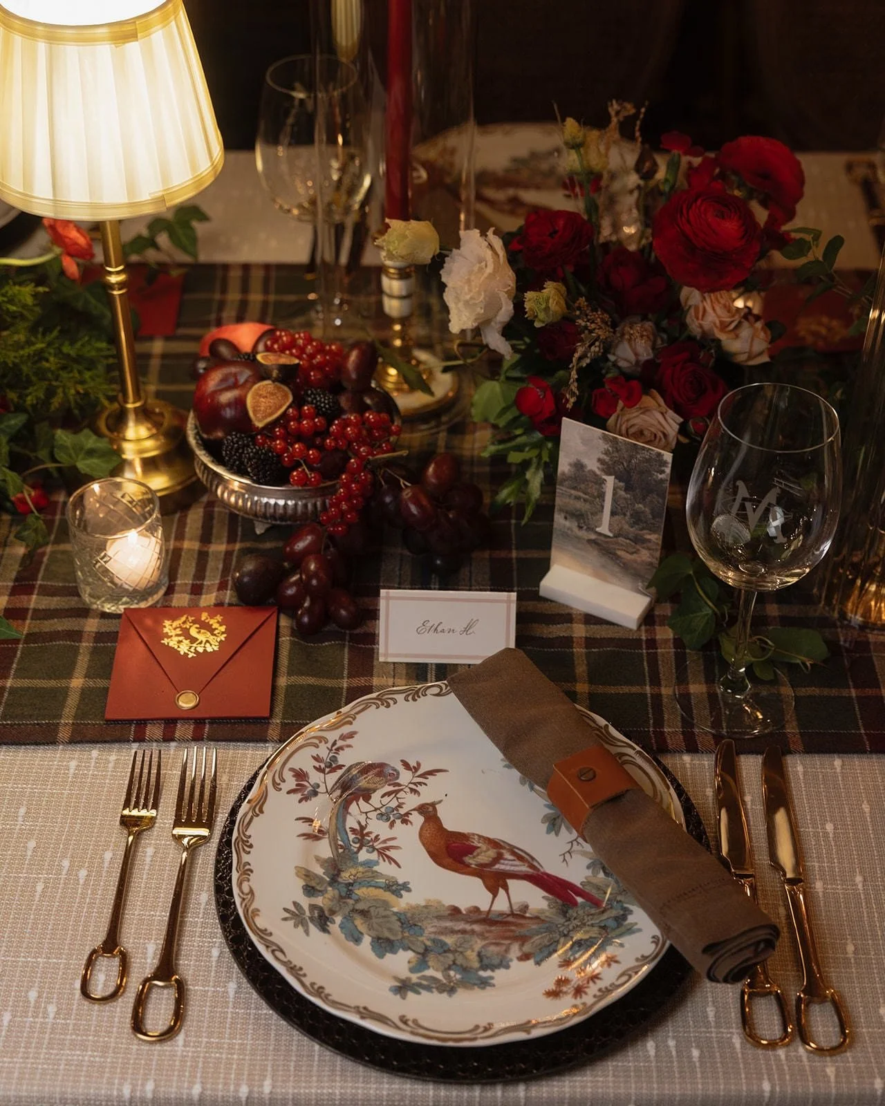 Design Notes from This Wedding: 

Oxford library elegance meets English pub coziness,
finished with a whisper of Scottish Highlands drama. 

C &amp; E came to us wanting old-world warmth with a little edge. We built the story through custom tartan ru