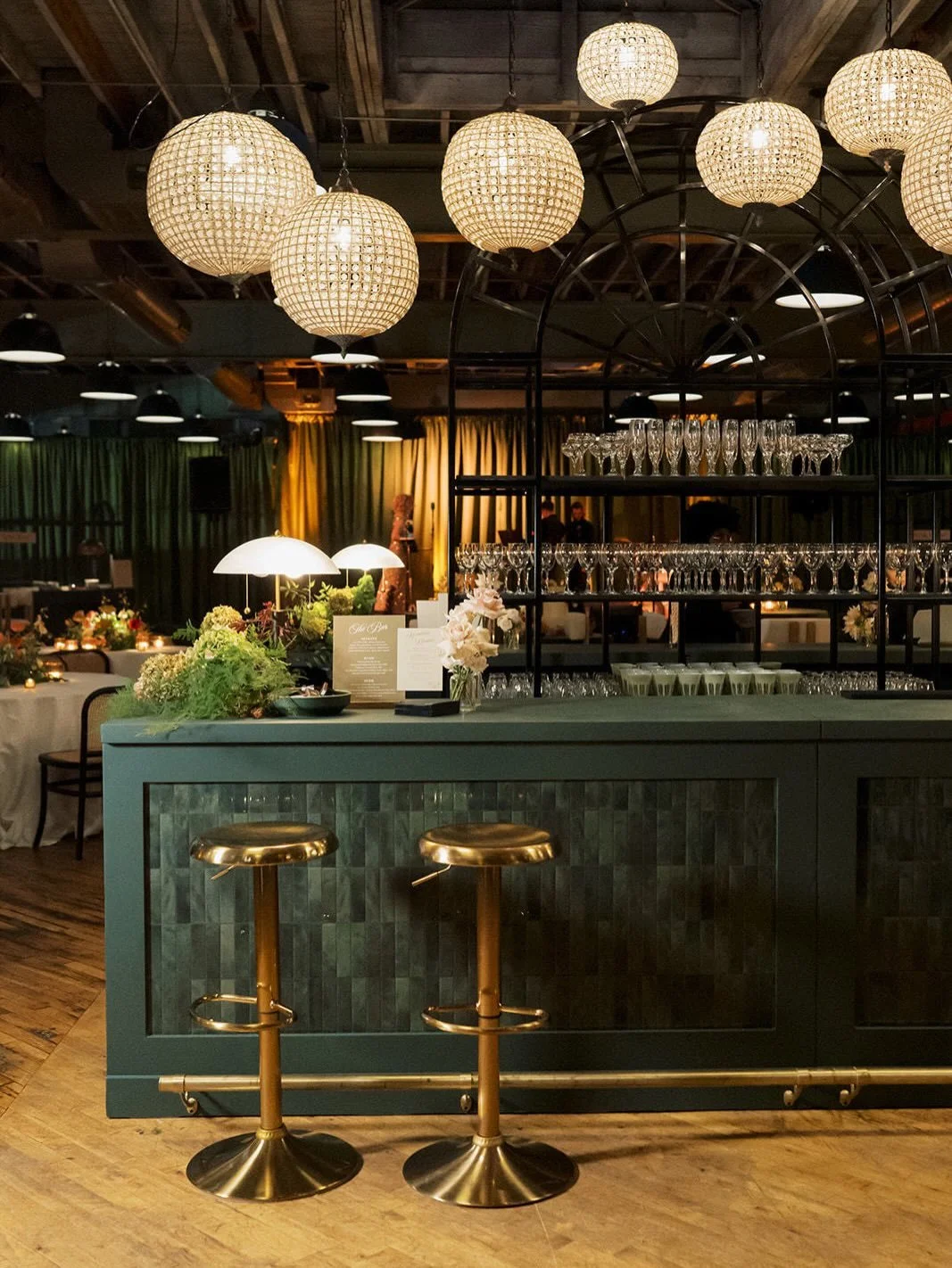 Is this a wedding or a late-night NYC jazz club?

Satin olive drape, a retro speakeasy&ndash;inspired custom bar, and a room built from the ground up to feel like a late-night lounge. S &amp; M didn&rsquo;t want a traditional wedding. They wanted a v