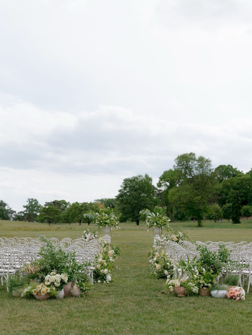 Some of the most meaningful wedding design details are the ones guests may never realize are there.

When K shared a photo from her parents&rsquo; wedding, we were immediately drawn to the ceremony as a whole, a large tree, an arch, and layers of pot