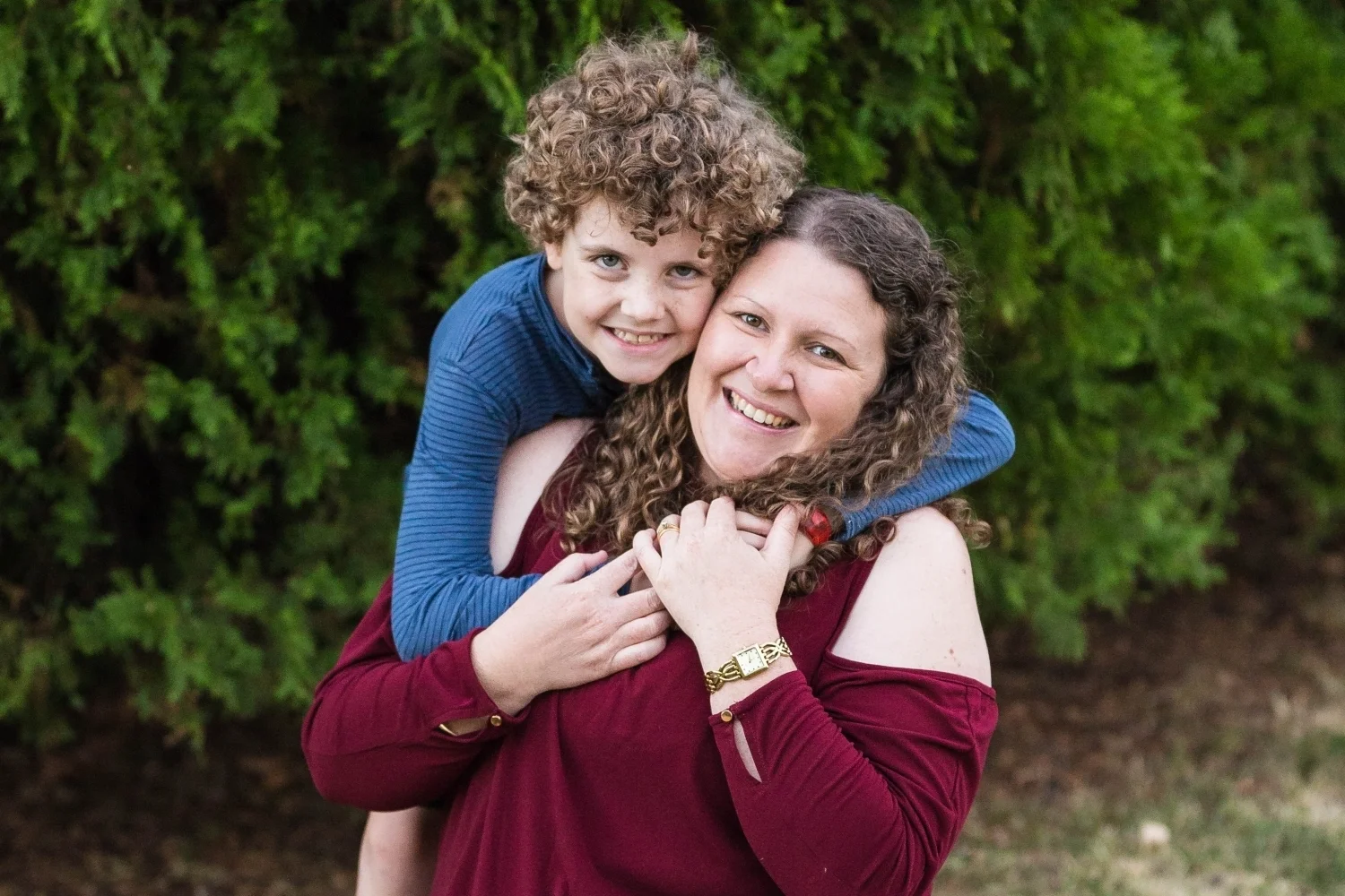 Son holding his Mum in Park.jpg