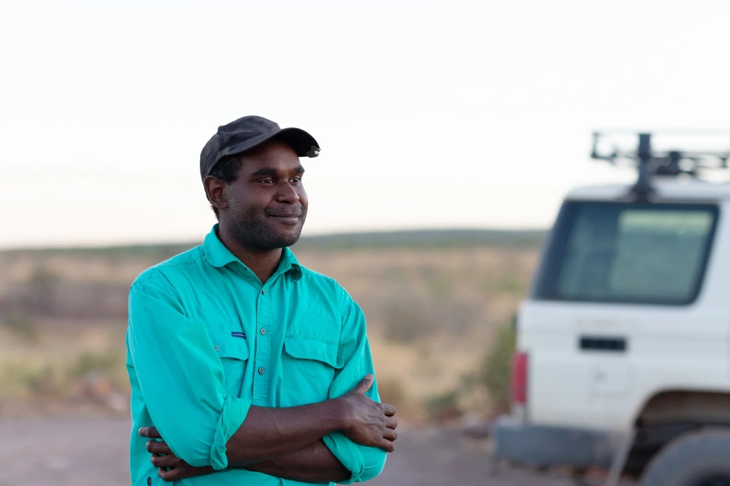 Man in outback with 4WD in background.jpg