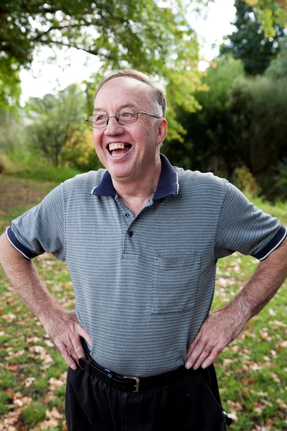 Man with hands on his hips outside.jpg