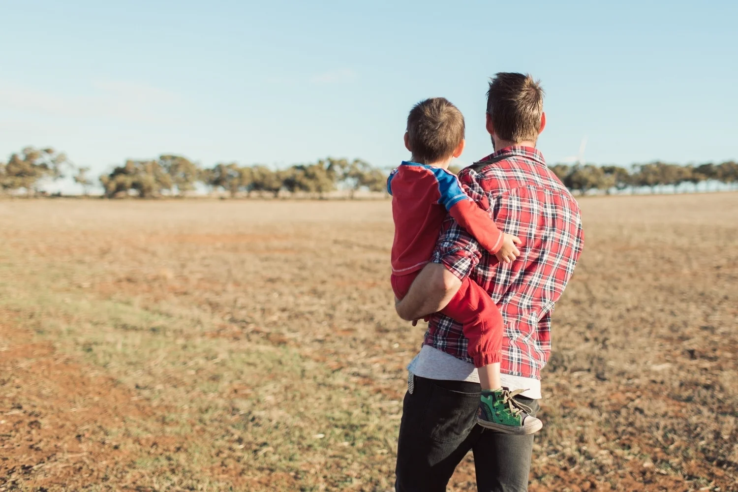 Back of Man and Boy standing in wheat field.jpg